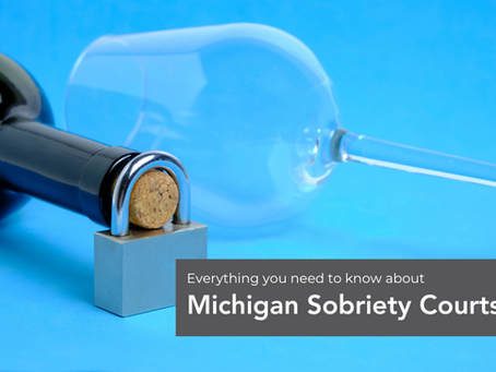 A bottle of wine with a lock around the neck symbolizes the recovery process that Michigan Sobriety Court can help with.