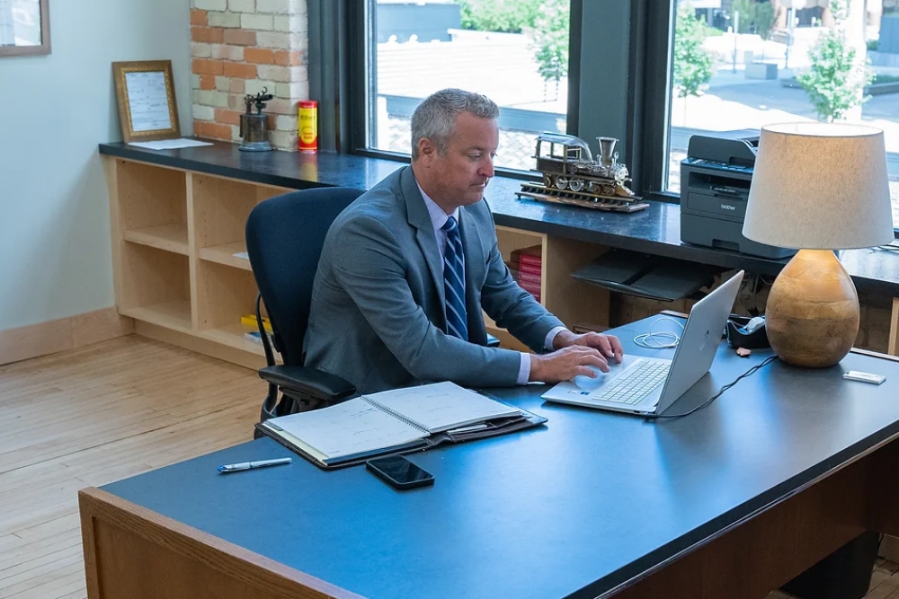 Attorney Mark Caldwell sits behind his desk working in his downtown Grand Rapids office.