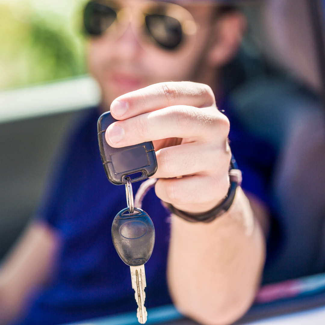 decorative image of driver holding his keys after getting his driver's license back.